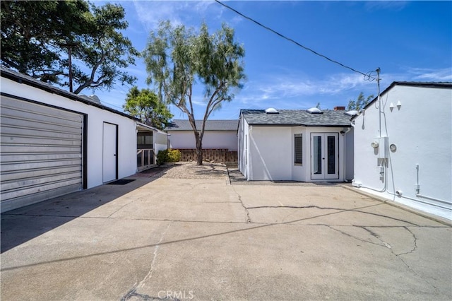 273 Almond St, San Luis Obispo, CA 93405 - back of property with french doors, stucco siding, and a patio area