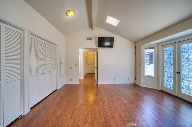 273 Almond St, San Luis Obispo, CA 93405 - unfurnished bedroom with wood finished floors, access to exterior, baseboards, and a skylight