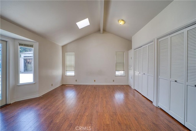 273 Almond St, San Luis Obispo, CA 93405 - unfurnished bedroom with a skylight, wood finished floors, multiple closets, and baseboards