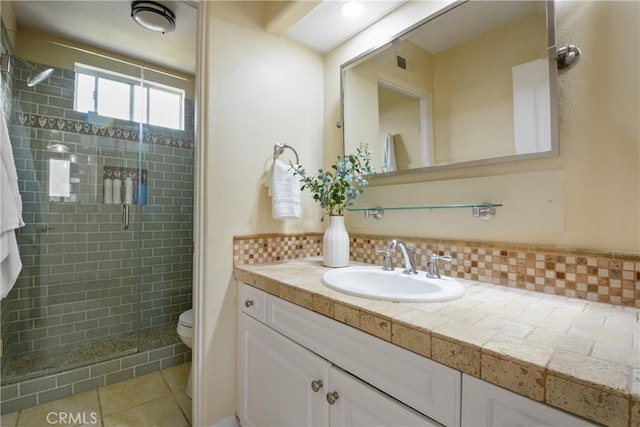 112 Del Cabo, San Clemente, CA 92673 - full bath with a stall shower, vanity, toilet, decorative backsplash, and tile patterned floors