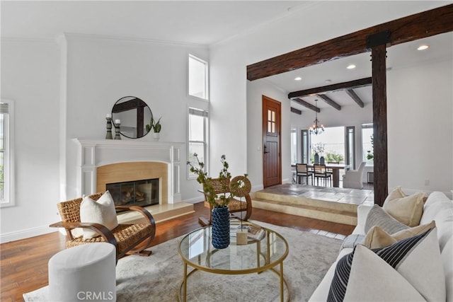 112 Del Cabo, San Clemente, CA 92673 - living room with wood finished floors, recessed lighting, baseboards, ornamental molding, and a fireplace