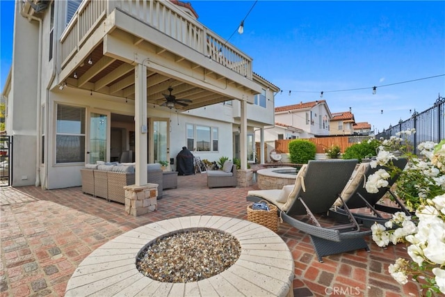 112 Del Cabo, San Clemente, CA 92673 - fenced backyard with a balcony, a ceiling fan, a patio area, and an outdoor living space with a fire pit