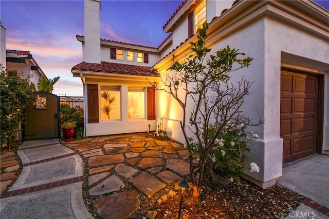 112 Del Cabo, San Clemente, CA 92673 - back of house with a tiled roof, a gate, and stucco siding