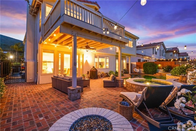 112 Del Cabo, San Clemente, CA 92673 - fenced backyard featuring a balcony, an in-ground hot tub, a patio area, a ceiling fan, and outdoor lounge area