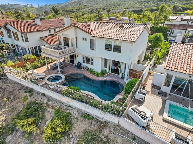 112 Del Cabo, San Clemente, CA 92673 - view of swimming pool featuring a fenced backyard, a mountain view, a pool with connected hot tub, and a patio area