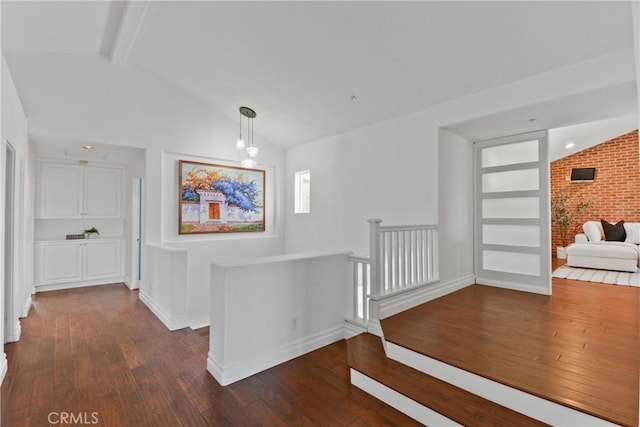 112 Del Cabo, San Clemente, CA 92673 - corridor with dark wood-style floors, an upstairs landing, baseboards, and brick wall