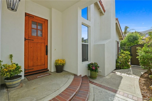 112 Del Cabo, San Clemente, CA 92673 - view of exterior entry featuring stucco siding and a gate