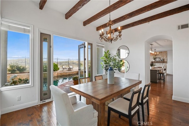 112 Del Cabo, San Clemente, CA 92673 - dining area featuring a chandelier, baseboards, dark wood finished floors, beamed ceiling, and arched walkways