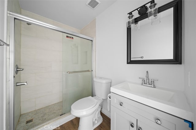 1377 Wheaton Way, Riverside, CA 92507 - full bath with toilet, a shower stall, vanity, and wood finished floors