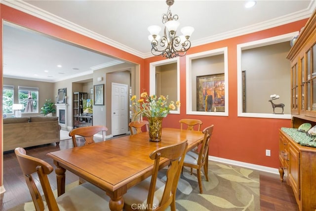 7151 Stockton Dr, Eastvale, CA 92880 - dining area with a chandelier, baseboards, wood finished floors, crown molding, and recessed lighting
