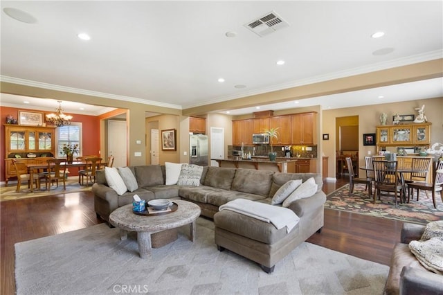 7151 Stockton Dr, Eastvale, CA 92880 - living room with wood finished floors, a chandelier, crown molding, and recessed lighting