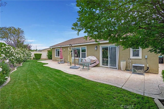 7151 Stockton Dr, Eastvale, CA 92880 - back of property with stucco siding, a patio area, and central AC
