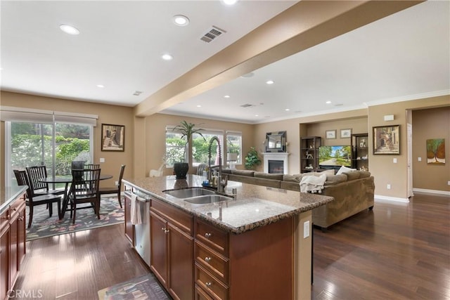 7151 Stockton Dr, Eastvale, CA 92880 - kitchen featuring a sink, baseboards, dark wood-type flooring, light stone counters, and recessed lighting