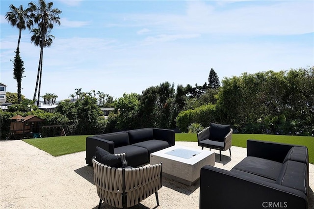 152 El Levante, San Clemente, CA 92672 - view of patio / terrace with an outdoor living space with a fire pit and view of wooded area