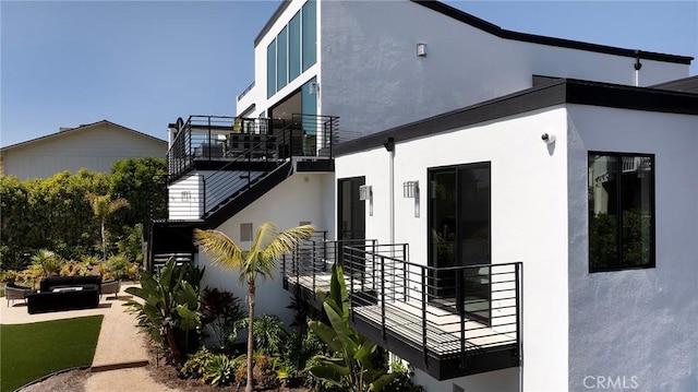 152 El Levante, San Clemente, CA 92672 - view of side of home featuring an outdoor living space, stucco siding, stairway, and a patio area