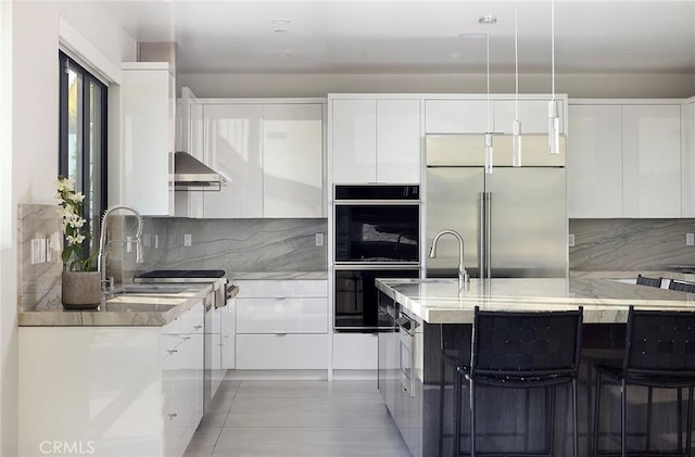 152 El Levante, San Clemente, CA 92672 - kitchen with modern cabinets, stainless steel built in refrigerator, and double wall oven