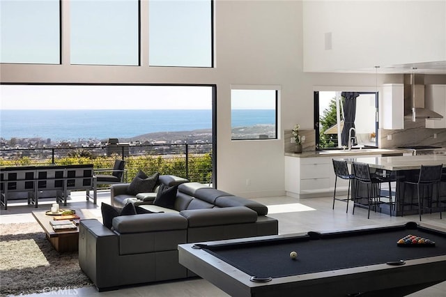 152 El Levante, San Clemente, CA 92672 - living room with pool table, a water view, a high ceiling, and healthy amount of natural light