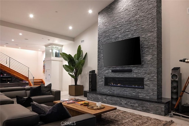 152 El Levante, San Clemente, CA 92672 - living room featuring stairs, recessed lighting, and a stone fireplace