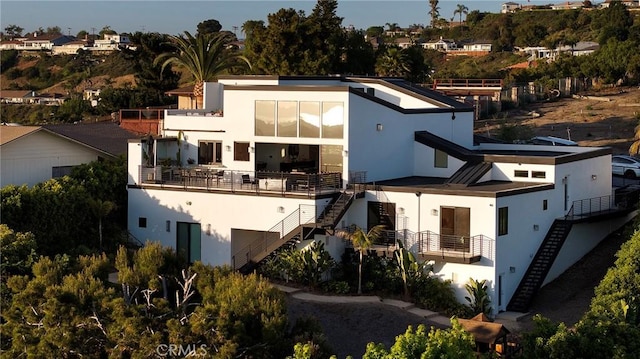 152 El Levante, San Clemente, CA 92672 - back of property featuring stucco siding, stairway, and a balcony