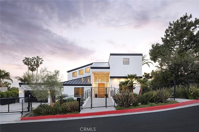 152 El Levante, San Clemente, CA 92672 - contemporary home featuring a standing seam roof, a fenced front yard, metal roof, and stucco siding
