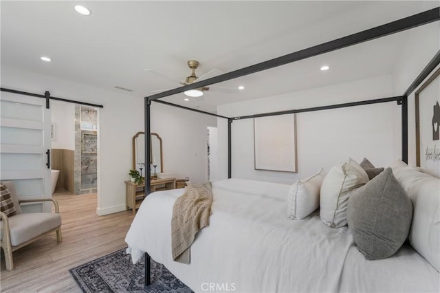 212 Oak Pl, Brea, CA 92821 - bedroom with light wood-style floors, recessed lighting, a barn door, a ceiling fan, and ensuite bathroom