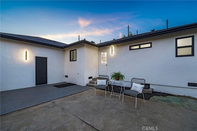 212 Oak Pl, Brea, CA 92821 - back of property at dusk with a patio and stucco siding
