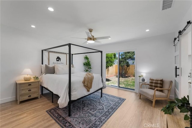 212 Oak Pl, Brea, CA 92821 - bedroom featuring a barn door, access to exterior, light wood-type flooring, recessed lighting, and baseboards