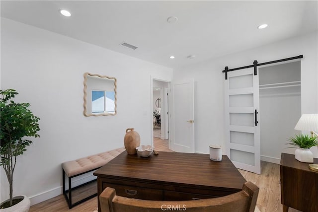212 Oak Pl, Brea, CA 92821 - office area featuring a barn door, light wood-style flooring, recessed lighting, and baseboards