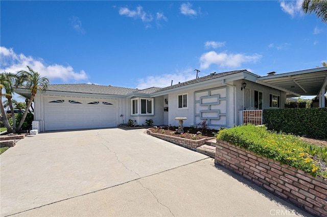 2620 W Cobblestone Rd, La Habra, CA 90631 - view of front of home featuring concrete driveway, a garage, and stucco siding