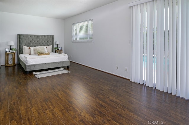 2620 W Cobblestone Rd, La Habra, CA 90631 - bedroom with dark wood-style flooring and baseboards