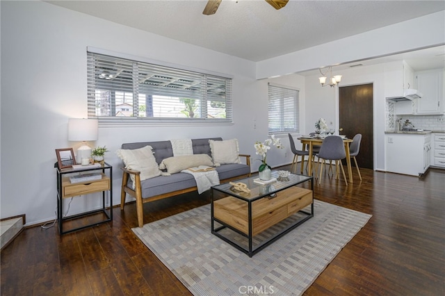 2620 W Cobblestone Rd, La Habra, CA 90631 - living area featuring dark wood-style flooring, ceiling fan, and a chandelier