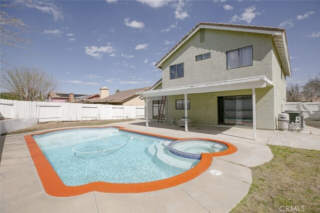 38633 Angele Trumpet Ct, Palmdale, CA 93550 - view of pool featuring a patio area, a fenced backyard, and a pool with connected hot tub