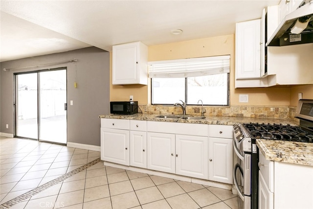 38633 Angele Trumpet Ct, Palmdale, CA 93550 - kitchen featuring under cabinet range hood, stainless steel gas range oven, black microwave, light tile patterned flooring, and a sink