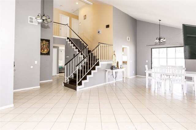 38633 Angele Trumpet Ct, Palmdale, CA 93550 - entrance foyer featuring a chandelier, high vaulted ceiling, stairs, and baseboards