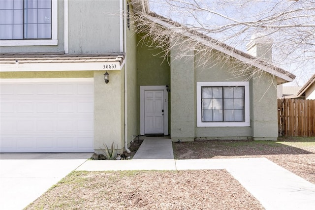 38633 Angele Trumpet Ct, Palmdale, CA 93550 - doorway to property featuring stucco siding