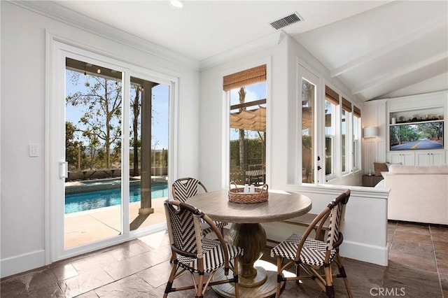 4 Sunswept Mesa, Aliso Viejo, CA 92656 - dining area with plenty of natural light, baseboards, stone tile floors, lofted ceiling, and crown molding