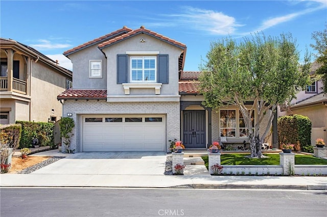 4 Sunswept Mesa, Aliso Viejo, CA 92656 - mediterranean / spanish house with a tile roof, concrete driveway, and brick siding