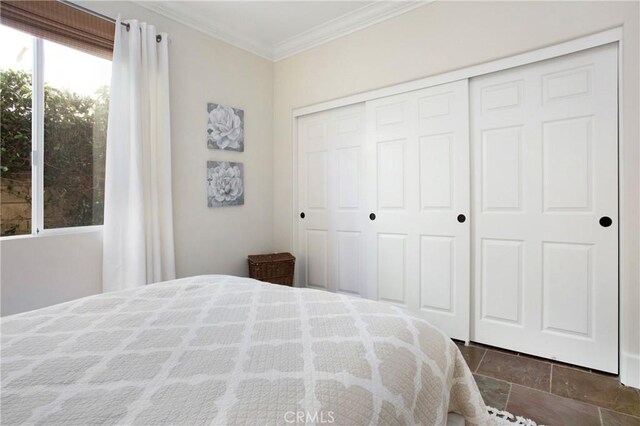4 Sunswept Mesa, Aliso Viejo, CA 92656 - bedroom with ornamental molding, a closet, and stone tile floors