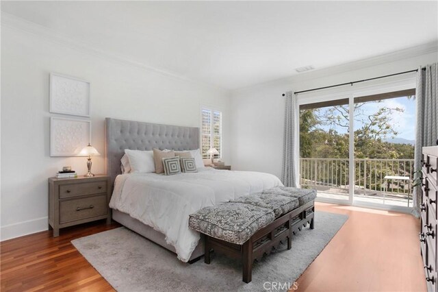 4 Sunswept Mesa, Aliso Viejo, CA 92656 - bedroom with access to outside, wood finished floors, multiple windows, baseboards, and crown molding