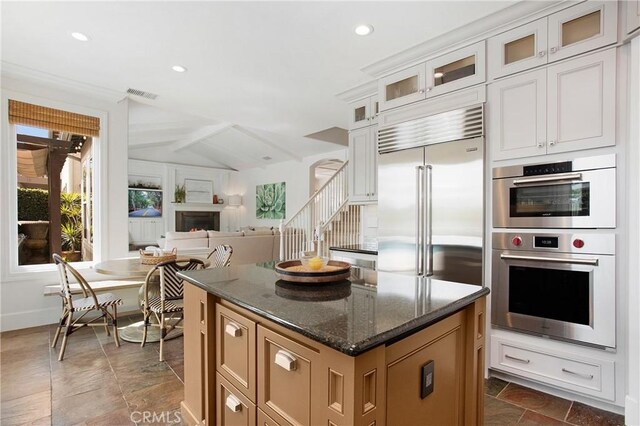 4 Sunswept Mesa, Aliso Viejo, CA 92656 - kitchen with stainless steel appliances, dark stone countertops, a center island, recessed lighting, and open floor plan