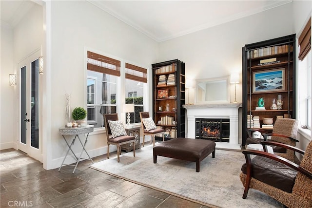 4 Sunswept Mesa, Aliso Viejo, CA 92656 - sitting room with ornamental molding, stone tile flooring, a glass covered fireplace, and baseboards