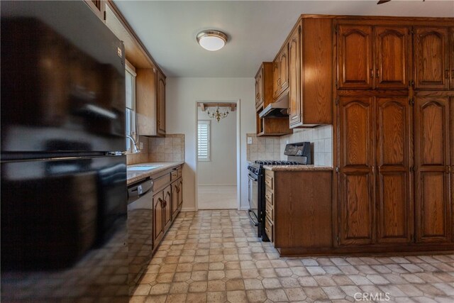 1991 Heather Dr, Monterey Park, CA 91755 - kitchen with black appliances, light countertops, backsplash, and brown cabinets