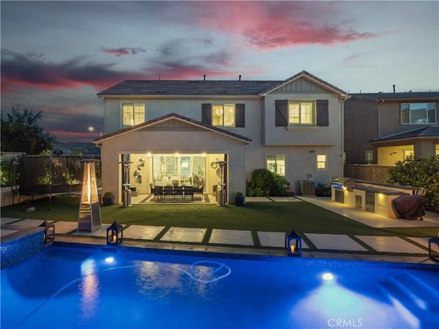 22385 Midtown Ct, Saugus, CA 91350 - rear view of property with exterior kitchen, stucco siding, a patio, and central air condition unit