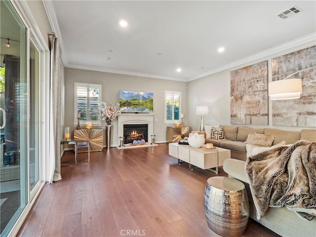22385 Midtown Ct, Saugus, CA 91350 - living room featuring hardwood / wood-style flooring, healthy amount of natural light, a lit fireplace, recessed lighting, and ornamental molding