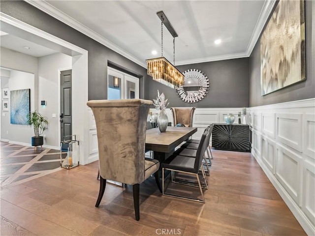 22385 Midtown Ct, Saugus, CA 91350 - dining area featuring ornamental molding, a chandelier, hardwood / wood-style flooring, recessed lighting, and a wainscoted wall