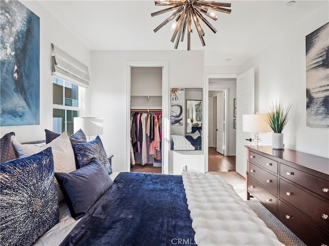 22385 Midtown Ct, Saugus, CA 91350 - bedroom featuring a chandelier, a spacious closet, a closet, and a ceiling fan