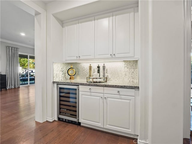 22385 Midtown Ct, Saugus, CA 91350 - indoor dry bar with beverage cooler, crown molding, backsplash, and dark wood finished floors