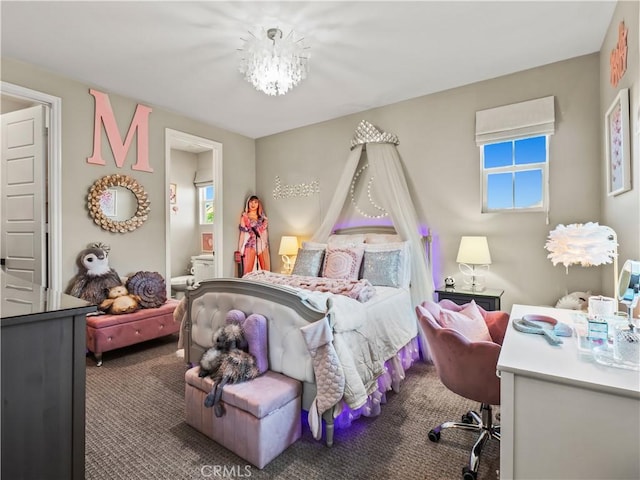 22385 Midtown Ct, Saugus, CA 91350 - carpeted bedroom with connected bathroom and a chandelier