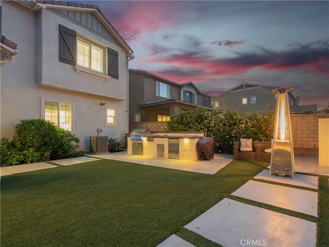 22385 Midtown Ct, Saugus, CA 91350 - back of house with area for grilling, a patio, stucco siding, board and batten siding, and central AC