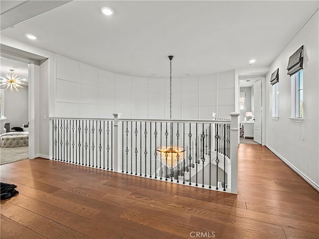 22385 Midtown Ct, Saugus, CA 91350 - hallway featuring hardwood / wood-style floors, recessed lighting, an upstairs landing, plenty of natural light, and baseboards